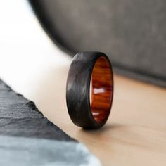 a wooden ring sitting on top of a table