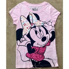 a pink shirt with minnie mouse on it