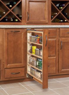 an open cabinet in the middle of a kitchen