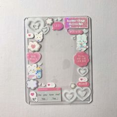 an image of a photo frame with hello kitty stickers on it