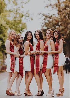 a group of women standing next to each other