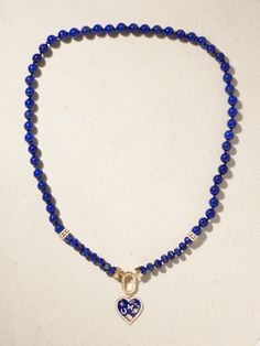 Take a close look at Sydney Evan's necklace and you'll see the heart charm it's strung with features the brand's signature 'Icon' motifs nestled inside - detach it on days you're after a more pared-back look. It's made from 14-karat gold and lapis lazuli and dusted with 1.28-carats of shimmering diamonds throughout. Blue Heart Charm Round Jewelry, Luxury Heart-shaped Sapphire Jewelry, Blue Fine Jewelry With Heart Charm, Blue Heart-shaped Fine Jewelry Necklace, Fine Jewelry Blue Heart Necklace, Blue Necklace With Heart Charm, Blue Heart Charm Fine Jewelry, Blue Necklace With Round Heart Charm, Blue Necklaces With Heart Charm And Round Shape