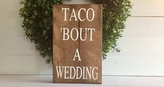 a wooden sign that says taco bout a wedding