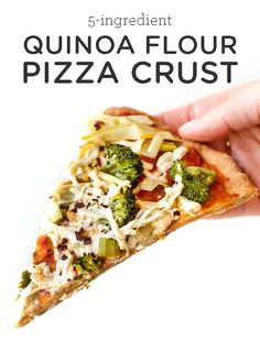 a hand holding a slice of quinoa flour pizza with broccoli and cheese