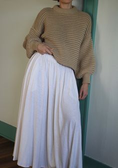 The Laurel Hemp Jersey Skirt boasts a remarkable fabric that combines the softness of a well-loved vintage t-shirt with the distinct texture of hemp. This versatile skirt is a must-have staple for effortless pairings with any item in your wardrobe. It features a bias cut for a refined touch, along with convenient side pockets and a chic drape, all secured with a simple elastic waistband and natural-hued woven cord. Made in USA Natalie Borton, House Clothes, Jersey Skirt, Knit Outerwear, Line Shopping, Curated Vintage, Clothing Line, Dress Suits, Vintage Cotton