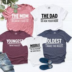 "Matching Family Shirts. Rules The Dad shirt - Go Ask Your Mom The Mom Shirt - Beacause I Said So Oldest Shirt - I'm the Reason We Have Rules Middle shirt - I Make The Rules Youngest Shirt - What Rules? HI! Welcome to my store, I'm delighted to see you here. My store's main goal is to provide you with premium everyday apparel with the best graphic t-shirts. I see you as a friend, not just a customer. I'm sure you'll love my designs. So, here is a brief description for you to-see-the order-proces Family Matching Crew Neck Cotton Tops, Family Matching Short Sleeve T-shirt With Letter Print, Family Matching Short Sleeve Tops With Letter Print, Family Matching Tops With Letter Print And Short Sleeves, Family Matching Slogan T-shirt With Crew Neck, Family Matching Slogan Cotton T-shirt, Family Matching Cotton T-shirt With Funny Text, Family Matching Cotton Slogan T-shirt, Basic Crew Neck Shirt With Funny Text