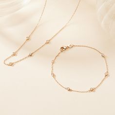 Glistening with effortless elegance, our Crystal Solitaire Necklace is a timeless essential for any jewellery collection. Featuring a chain adorned with mini crystals, this necklace adds subtle sparkle with every movement, perfect for dressing up an everyday look.&nbsp;18K Champagne Gold PlatedChain length: 46cm, adjustable to 43cm &amp; 41cmDiameter Zircon: 3mmSent with love in a complimentary gift box Dainty Cubic Zirconia Chain Necklace With Delicate Chain, Dainty Cubic Zirconia Delicate Chain Necklace, Delicate Gold Plated Diamond Necklace With Delicate Chain, Elegant Everyday Diamond Necklace With Delicate Chain, Delicate Diamond Necklace With Adjustable Chain For Everyday, Delicate Diamond Station Necklace, Dainty Diamond Necklace With Satellite Chain, Dainty Diamond Necklace With Delicate Chain, Delicate Gold-plated Diamond Necklace