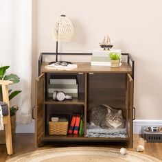 a cat laying on top of a bed under a book shelf