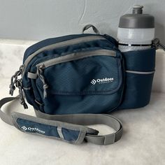 Outdoor Products Shoulder Bag/ Fanny Or Waist Pack With 600ml Water Bottle Never Used But No Tags. Questions? Leave A Comment Below! Blue Bag With Water Bottle Pocket For Outdoor Activities, Functional Blue Shoulder Bag For Outdoor Activities, Functional Blue Shoulder Bag For Outdoor, Multifunctional Blue Bags For Outdoor, Blue Shoulder Bag With Pockets For Outdoor Activities, Blue Multifunctional Outdoor Bags, Multifunctional Blue Outdoor Bags, Sporty Blue Shoulder Bag With Pockets, Practical Blue Bag For Outdoor Activities