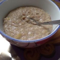 a bowl of oatmeal with a spoon in it