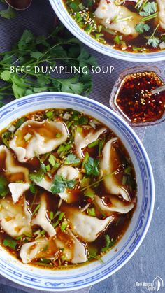 two bowls of beef dumpling soup with chopsticks and garnishes