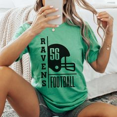 Hey there, football fan! Ready to showcase your team spirit with a personalized touch? Our Custom Football Team & Number Graphic Tee lets you represent your favorite team and player in style. Whether you're at the stadium, hosting a tailgate party, or cheering from home, this tee combines comfort and sporty flair. Crafted from ultra-soft, high-quality cotton, our Custom Football Team & Number Graphic Tee ensures comfort and durability throughout the season. Its relaxed fit and premium fabric kee High School Football Jersey, Football Rivalry Shirts, Football Playoff Shirts Ideas, Game Day Shirt Ideas, Sport Tshirt Designs Ideas, Team Tshirt Ideas, Football Shirts Ideas, School Sports Shirts, Circuit Shirts