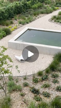 an aerial view of a pool surrounded by plants and rocks, with a video showing how to use it