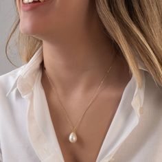 This bold pearl necklace is made of real freshwater pearl and 18k solid real gold. You can buy only pendant or pendant with chain. Please choose from options list.  There is a single real pearl pendant on the necklace. Pearl shape is teardrop. Chain style is cable chain and 1 mm (0.03 inch) thickness. Lenght of chain: 50 cm (19,6 inch) Dimensions of pearl: H: 22 mm (0,86 inch) W: 10 mm (0,39 inch) Our pearls has got smooth surface. Shape and dimensions can be slightly different because it's natu Elegant Baroque Pearl Drop Necklace As Gift, Elegant Baroque Pearl Drop Necklace Gift, Yellow Gold Briolette Pearl Drop Necklace, Akoya Pearl Teardrop Necklaces With Pearl Chain, Teardrop Akoya Pearl Chain Necklaces, Teardrop Akoya Pearl Necklaces With Pearl Chain, Delicate Briolette Pearl Necklace Gift, Classic Necklace With Pearl Chain And Teardrop Pendant, Classic Drop-shaped Pearl Pendant Jewelry