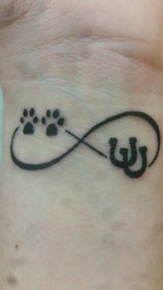 a dog's paw and name tattoo on the chest