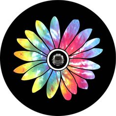 a colorful flower is in the center of a black circle with white and yellow petals