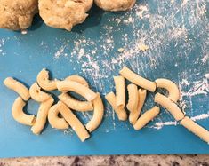 doughnuts and macaroni on a blue cutting board