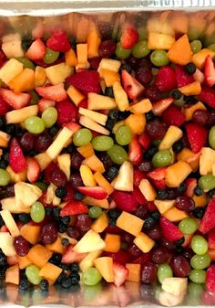 a tray filled with lots of different types of fruit