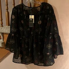 Outstanding Lucky Brand Sheer Black With Floral Print, Lace And Bell Sleeves. So Romantic And Gorgeous, 100% Polyester, Machine Wash. Tassles In Front Can Be Tied Or Left Loose For V Neck. Lightly Gathered Waist. Size Large. Measurements: Pit To Pit: 20 Inches Length: 26 Inches Elegant V-neck Peasant Top For Fall, Chic Black Peasant Top For Spring, Casual Bell Sleeve Peasant Top For Fall, Casual Bell Sleeve Blouse For Fall, Black Long Sleeve Peasant Top, Long Sleeve Black Peasant Top For Fall, Black Floral Print Blouse For Fall, Casual Peasant Top With 3/4 Sleeve For Fall, Fall Blouse With Blouson Bell Sleeves