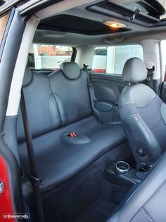 the interior of a car with black leather seats