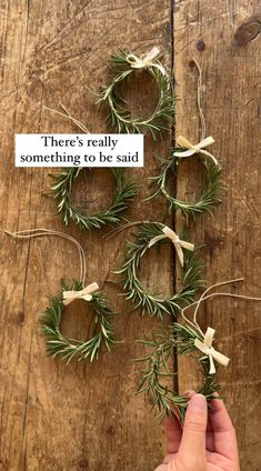 someone is trying to make some rosemary wreaths