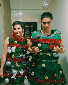 two people dressed up as christmas trees