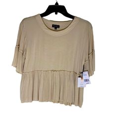 Originality Pleated Ruffle Hem Flowy Top 1/2 Sleeves Rayon, Spandex Blend Machine Wash Size Small New With Tags. Stretch Top With Ruffle Hem For Summer, Stretchy Summer Tops With Ruffle Hem, Stretch Tops With Ruffle Hem For Summer, Fitted Beige Top With Ruffle Sleeves, Beige Fitted Top With Ruffle Sleeves, Stretch Ruffle Tops For Layering, Ruffle Sleeve Tops For Summer Layering, Tiered Tops For Layering, Fitted Tiered Tops With Ruffle Hem