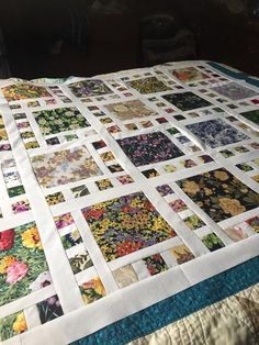 a quilted table top with many different pictures on it