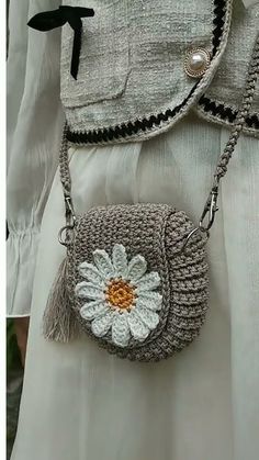 a woman's purse with a flower on it