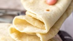 a stack of tortillas sitting on top of a plate