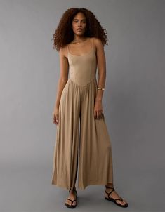 Discover the ultimate in comfort and style with our Soft & Sexy Jumpsuit in Sand Brown. Perfect for casual outings or chic evenings, this flattering jumpsuit offers a relaxed fit and luxurious fabric that hugs your body. Shop now for a versatile wardrobe essential that's both stylish and comfortable! Luxury Fabrics, Wardrobe Essentials, Women's Jeans, American Eagle Outfitters, American Eagle, Women Jeans