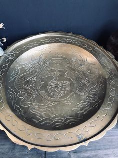 a metal tray sitting on top of a wooden table