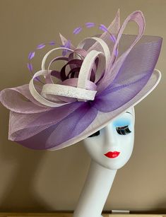 "Three layers of sinamay with large bow and sinamay flowers, elegant, light and comfortable to wear. Perfect for weddings, Royal Ascot horse races, cocktails, tea party, derby, or any hat wearing occasion. Warm tips: ❤️If you are looking for a customized piece, please send me a message and let's create something unique just for you! ❤️Group discount on 3 or more pieces, please contact me for further information on group discount. ❤️Due to the nature of my items, I do not accept returns, but cont Fitted Lavender Headpieces For Summer, Adjustable Purple Fascinator For Summer, Lavender Hat Fascinator For Spring, Purple Short Brim Fascinator For Royal Ascot, Adjustable Lavender Fascinator For Weddings, Lavender Fascinator Hat For Spring, Fitted Purple Fascinator For Spring, Fitted Lavender Fascinator For Summer, Purple Fitted Fascinator For Spring