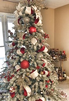 a decorated christmas tree with red and white ornaments