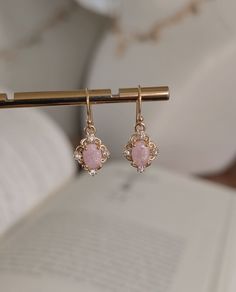 DAINTY PINK STONE GOLD EARRINGS  DETAILS  *Handmade in my small boutique studio  *Petite earrings, minimal but stylish  *Size of charm 1.5cm *Ear wires are gold filled *Your earrings will arrive safely packaged in a jewelry gift bag Please note - earrings are none returnable due to hygiene reasons. DELIVERY DEATAILS* *All UK orders are sent via the Royal Mail 1st Class Signed for service. *All international orders are sent via a Tracked and Signed service where possible. SHOP MORE STYLES: Honeya Elegant Pink Drop Plug Earrings, Pink Drop Earrings For Pierced Ears, Vintage Pink Dangle Earrings, Pink Drop Crystal Earrings For Pierced Ears, Vintage Pink Drop Earrings, Pink Gold Drop Earrings, Dainty Pink Drop Earrings, Dainty Pink Dangle Earrings, Dainty Pink Round Earrings