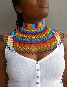 African Beaded wedding necklace, Zulu Cape necklace, Beaded shawl necklace, Christmas gift for her, Women jewelry, Bridesmaid giftThis beaded bib necklace is superbly crafted which can be worn with any outfit at different occasions and it will absolutely makes you stand out.Main color -multi color /rainbow.The necklace can be available in different colors.Wholesale available at a fair price,please contact me.For any clarification,please send me a convo or an e-mail.Thank you for visiting and hap Wedding Multicolor Beaded Chain Beads, Bohemian Multicolor Beaded Necklaces For Wedding, Multicolor Beaded Chain Necklace For Wedding, Multicolor Beaded Necklace For Wedding, Bohemian Multicolor Beaded Necklace For Wedding, Handmade Multicolor Bridal Necklace With Round Beads, Multicolor Beaded Choker For Wedding, Multicolor Handmade Choker For Wedding, Multicolor Beaded Choker For Celebration