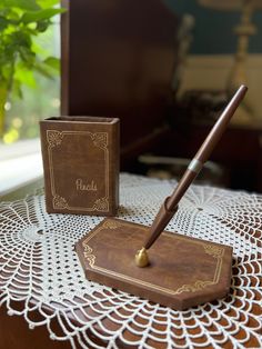 a pen sitting on top of a wooden box