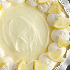 a pie with lemons and marshmallows on it