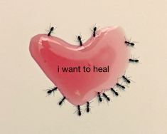 a pink heart shaped balloon with black ants on it that says i want to heal