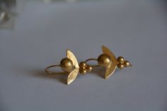 Gold earrings, tropic flower, unique earrings, vintage earrings, gold jewelry, gift for her, delicate earrings, bridal jewelry, efrat makov by EfratMakovJewelry on Etsy Vintage Yellow Gold Flower Earrings, Delicate Brass Wedding Earrings, Dainty Yellow Gold Flower Earrings For Wedding, Brass Flower Earrings For Wedding, Handmade Gold Flower Earrings For Wedding, Yellow Gold Brass Flower Earrings For Wedding, Elegant Floral Earrings With French Hook, Elegant Flower Shaped Earrings With French Hook, Flower Shaped Brass Wedding Earrings