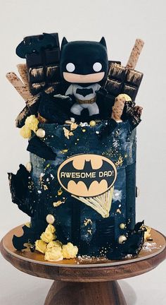 a batman cake with popcorn on top and an awesome dad's day message in the middle