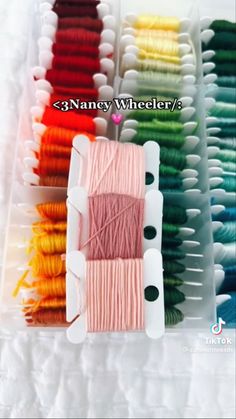 many different colors of thread in plastic containers