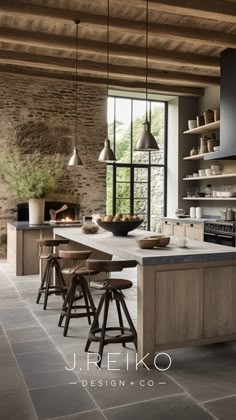 an image of a kitchen setting with stools and counter tops in the middle of the room