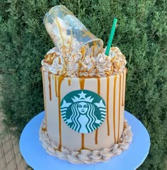 a starbucks cake with caramel drizzles and whipped cream on the top