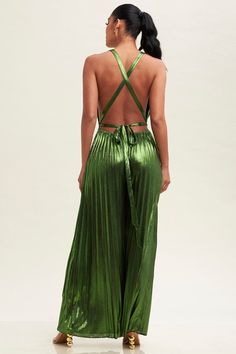 Be the day's style star in this eye-catching, moss green metallic jumpsuit. Featuring a pleated design and tie-back for a chic fit, you'll be sure to make a statement! Get ready to sparkle and shine! Green Backless Jumpsuits For Party, Green Backless Jumpsuits And Rompers For Party, Green Sleeveless Jumpsuits For Evening, Green Sleeveless Jumpsuits And Rompers For Evening, Sleeveless Pleated Party Jumpsuits And Rompers, Pleated Fitted Jumpsuits And Rompers For Party, Glamorous Green Jumpsuits And Rompers For Evening, Chic Green Jumpsuits And Rompers For Night Out, Evening Jumpsuits And Rompers With Tie Back