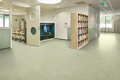 an empty library with bookshelves and tables