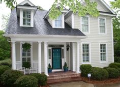 a white house with blue door and windows