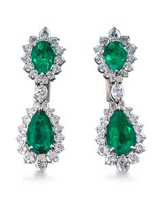 Four exquisite pear-shaped Colombian emeralds totaling 7.45 carats display their lush green hue alongside 4.43 carats of brilliant white diamonds in these earrings. The emeralds are certified by the American Gemological Laboratories. Set in platinum. Vintage Emerald Earrings, Emerald And Diamond Earrings, Green Statement Earrings, Real Diamond Earrings, Columbian Emeralds, Platinum Earrings, Colombian Emeralds, Expensive Jewelry, Antique Necklace