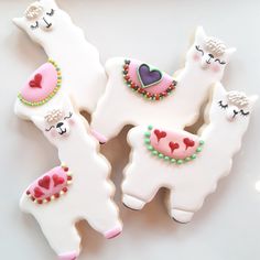 three decorated llama cookies sitting next to each other