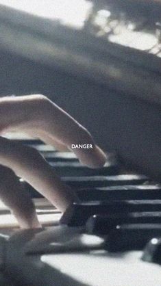 a person is typing on a keyboard with the word danger